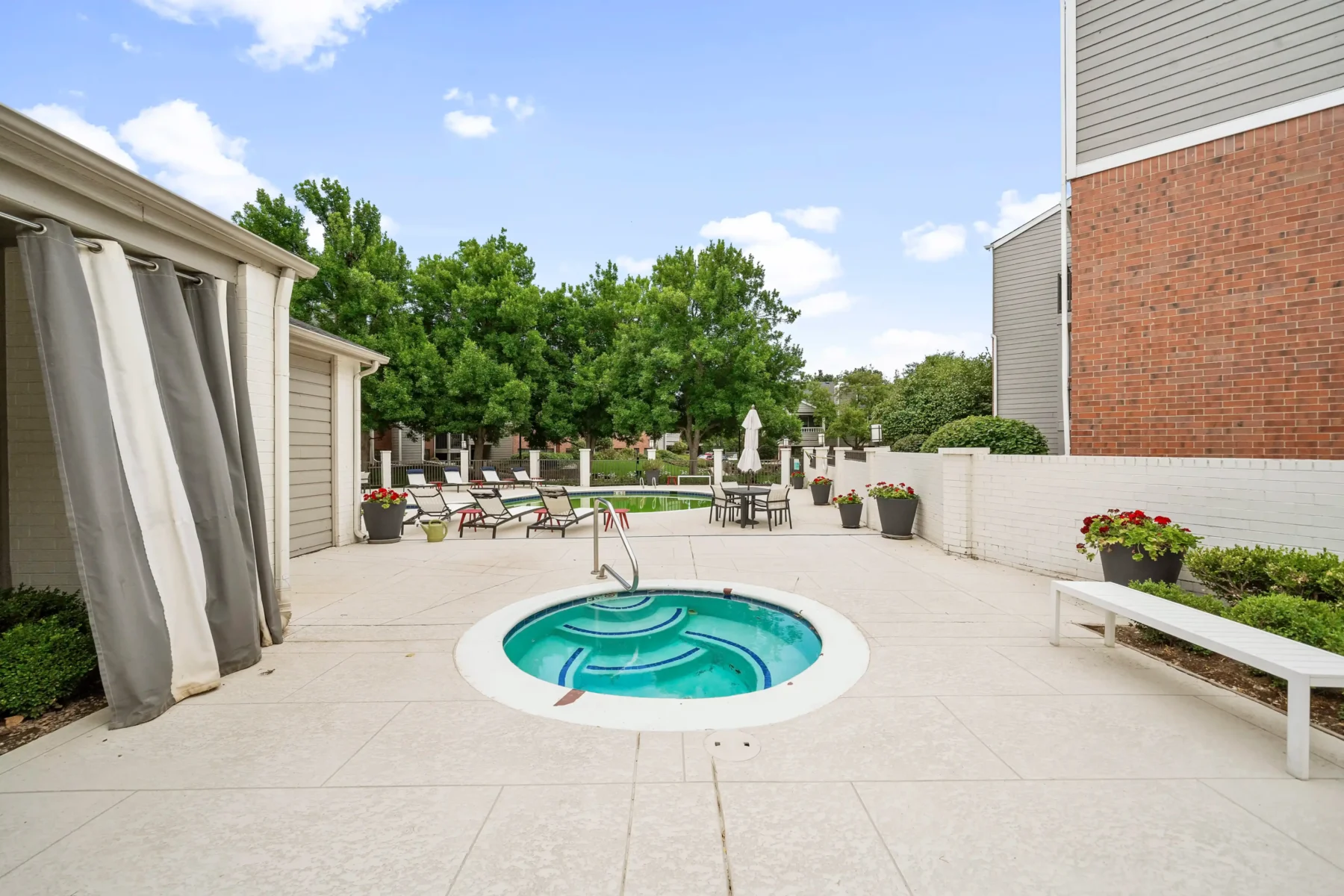 Pool and jacuzzi with deck seating