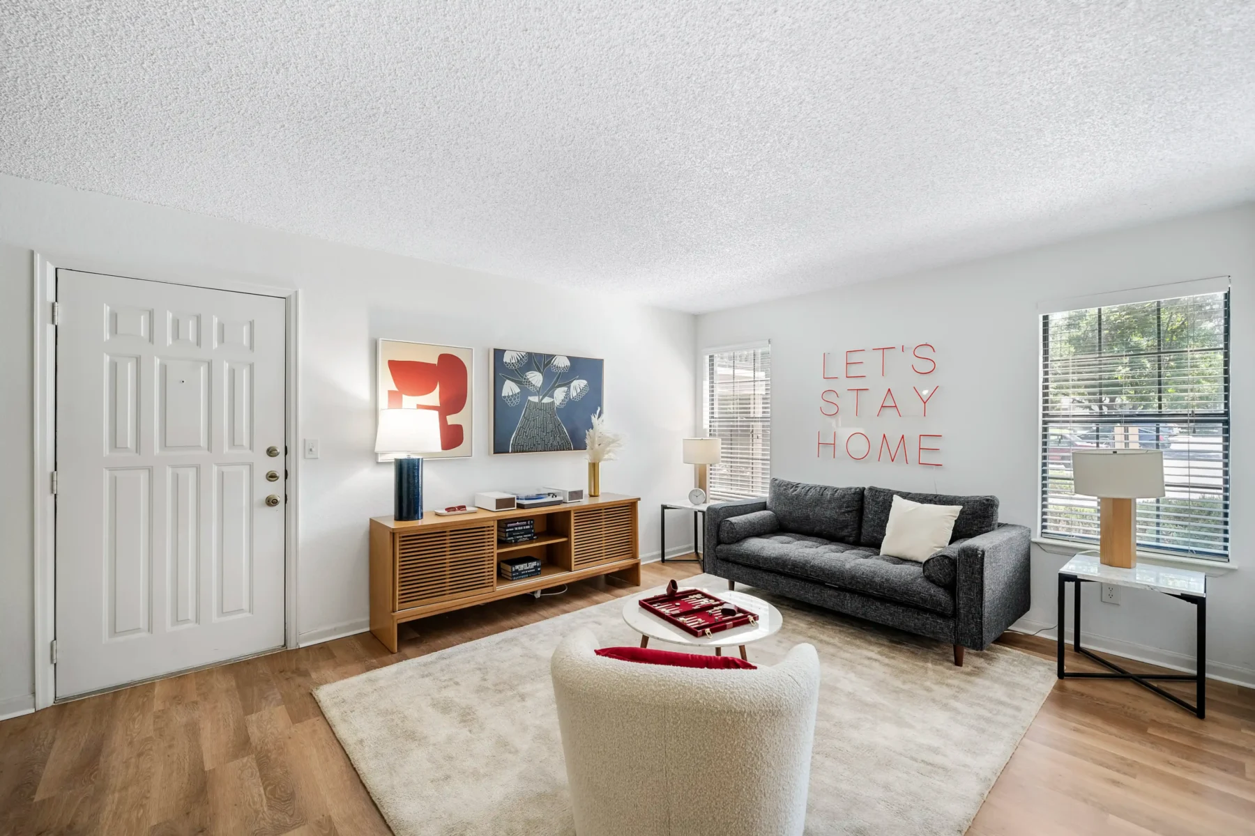 Open concept living room with large windows